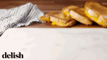 Stack Of Grilled Cheese And Burger Patty GIF - Grilled Cheese Stack Up Burger Patty GIFs