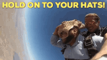 Sky Diving Hold On Your Hats GIF - Sky Diving Hold On Your Hats GIFs