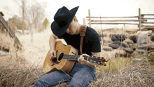 playing guitar guitarist guitar chill cowboy hat
