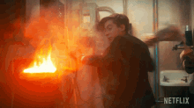 Putting Out A Fire Five GIF - Putting Out A Fire Five Aidan Gallagher GIFs