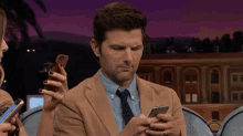 adam scott worried worried about a text texting what are you texting