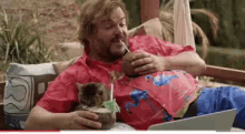 lil bub drinking jack black hanging out chilling