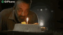 Blow The Candle Gifkaro GIF - Blow The Candle Gifkaro Make A Birthday Wish GIFs
