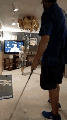 Golf Trick Shot Toilet Paper Father And Son Balloons Man Cave Great Value GIF - Golf Trick Shot Toilet Paper Father And Son Balloons Man Cave Great Value GIFs