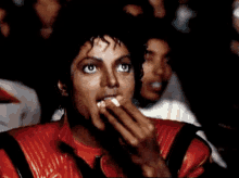 Michael Jackson Watching A Movie And Eating Popcorn GIF - Movie Time Movie Theater GIFs