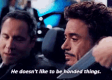 Doesnt Like Being Handed Things Tony Stark GIF - Doesnt Like Being Handed Things Tony Stark Iron Man GIFs