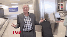 regis philbin jacket airport tmz interview