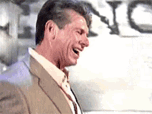 vince-mcmahon-laughing-hysterically.gif