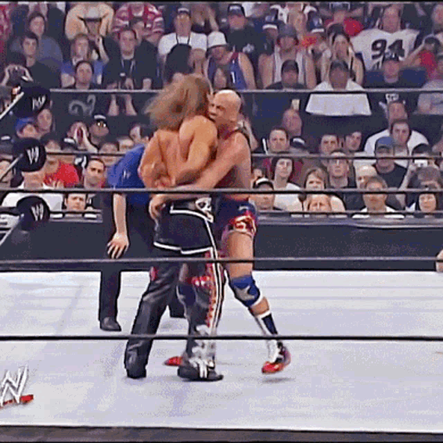 [IMAGE:https://c.tenor.com/nWCzloturaEAAAAd/kurt-angle-shawn-michaels.gif]