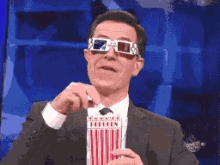 Stephen Colbert Popcorn GIF - Stephen Colbert Popcorn Watching You GIFs