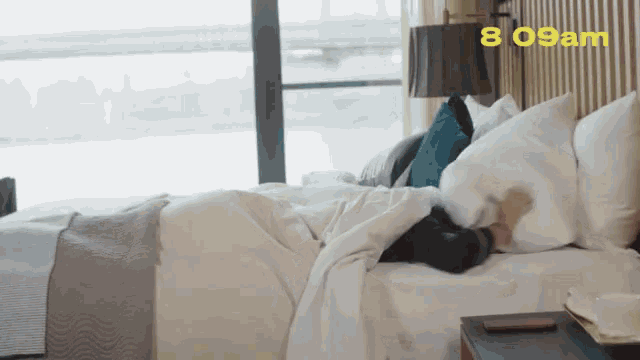 checking-phone-bed.gif