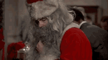 Creepy Santa Taking A Sip GIF - Dan Aykroyd Sip Party GIFs