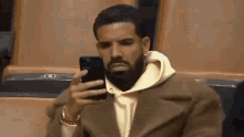 Drake Phone Drake Mad Looking At Phone GIF - Drake Phone Drake Mad Looking At Phone Drake Looking At Phone GIFs
