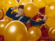Caught In Balloons GIF - Mtv Awards Adam Devine Caught Up GIFs