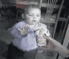 Baby Trying To Drink Shake Through Window Baby Fail GIF - Baby Trying To Drink Shake Through Window Baby Fail Drink Fail GIFs