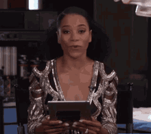 Kelly Mccreary Tablet GIF - Kelly Mccreary Tablet Look Up GIFs