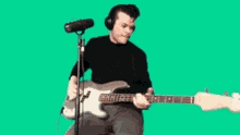 Tuning A Guitar Jeremy Pritchard GIF - Tuning A Guitar Jeremy Pritchard Everything Everything GIFs