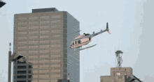 Helicopter Flying GIF - Helicopter Flying Building GIFs