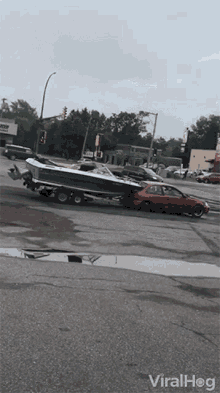 Towing Boat Small Car GIF - Towing Boat Small Car Smashing Car GIFs