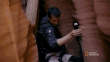 Having A Hard Time Bear Grylls GIF - Having A Hard Time Bear Grylls Joel Mchale In A Slot Canyon GIFs