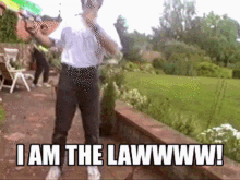 I Am The Law Water Gun GIF - I Am The Law Water Gun Playful GIFs