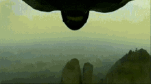 Hang Glider Tight Fit Between Rocks GIF - Tight Fit Tight Squeeze Get It In GIFs