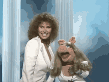 miss piggy raquel welch muppet show white suit over the shoulder