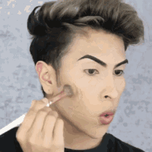 Funny Face Applying Makeup GIF - Funny Face Applying Makeup Pouty Lips GIFs