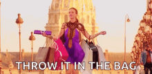 Shop Living In Light Sale GIF - Shop Living In Light Sale Throw It In The Bag GIFs