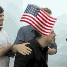 marcus mumford ted dwane mumford and son hug flag of the united states
