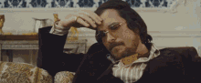 Mrw My Girlfriend Asks If I Ate The Entire Box Of Thin Mint Girl Scout Cookies GIF - American Hustle Christian Bale GIFs