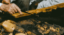 Examining A Mummy Howard Carter GIF - Examining A Mummy Howard Carter National Geographic GIFs