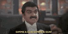 Johnny Dangerously Moronie GIF - Johnny Dangerously Moronie Gimme A Gun GIFs