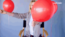 pop a balloon cara delevingne marie claire burst a balloon confetti