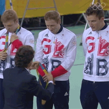 Gold Medal Team Britain GIF - Gold Medal Team Britain Congratulations GIFs