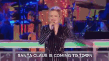 Santa Claus Is Coming To Town Singing GIF - Santa Claus Is Coming To Town Singing Performing GIFs