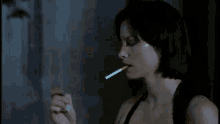 Sienna Guillory Light Up GIF - Sienna Guillory Light Up Smoking GIFs
